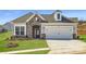 Charming home with a stone facade, two-car garage, and well-manicured lawn at 5926 Oak Branch Cir, Maiden, NC 28650
