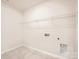 Unfinished laundry room with wire shelving and tile floor at 5926 Oak Branch Cir, Maiden, NC 28650