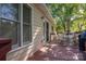Exterior of home featuring a wooden back deck with dining and bbq areas and mature trees at 602 S Church St, Lowell, NC 28098