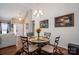 Charming dining area with a chandelier and connection to the living room at 602 S Church St, Lowell, NC 28098