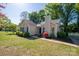 Inviting single-Gathering home with a manicured lawn, fresh mulch beds, and a classic chimney at 602 S Church St, Lowell, NC 28098