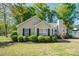 Charming single-story home featuring a well-manicured lawn and tasteful landscaping with black shutters at 602 S Church St, Lowell, NC 28098