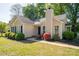 Charming single-story home featuring a well-manicured lawn and tasteful landscaping with black shutters at 602 S Church St, Lowell, NC 28098