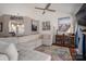 Bright living room with vaulted ceilings, modern fan, plush sectional and art at 602 S Church St, Lowell, NC 28098