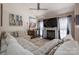 Comfortable living room includes a fireplace, television, and large sectional couch at 602 S Church St, Lowell, NC 28098