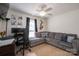 Comfortable living room featuring a plush sofa, desk, and musical art at 602 S Church St, Lowell, NC 28098