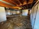 Unfinished basement with exposed beams, concrete floor, and simple design at 614 Hazelwood Dr, Albemarle, NC 28001