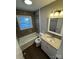 Bathroom featuring granite countertops and updated fixtures at 614 Hazelwood Dr, Albemarle, NC 28001