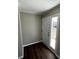 Entryway featuring hardwood floors, neutral paint, and a sidelight window at 614 Hazelwood Dr, Albemarle, NC 28001