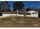 Charming one-story home with white painted brick, brown roof, and attached garage at 614 Hazelwood Dr, Albemarle, NC 28001