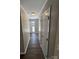 Hallway featuring hardwood floors and neutral paint at 614 Hazelwood Dr, Albemarle, NC 28001
