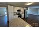 Open kitchen with stainless steel appliances and view to a living space at 614 Hazelwood Dr, Albemarle, NC 28001