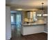Beautiful kitchen with an island bar, modern appliances and new wood floors at 614 Hazelwood Dr, Albemarle, NC 28001