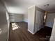 Bright living room featuring hardwood floors, neutral paint, and built-in shelving at 614 Hazelwood Dr, Albemarle, NC 28001