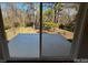 Covered patio with railing, overlooking the backyard at 614 Hazelwood Dr, Albemarle, NC 28001