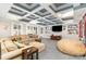 Finished basement with large entertainment area, comfortable sectional, and custom ceiling at 717 Barossa Valley Nw Dr, Concord, NC 28027