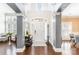 Bright foyer with soaring ceilings, dark wood floors, neutral walls, and an arched front door with sidelights at 717 Barossa Valley Nw Dr, Concord, NC 28027