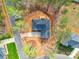 Overhead view of brick home with a well-kept yard, set amidst lush trees at 725 Granna Ln, Lancaster, SC 29720
