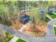 Aerial shot of a brick home with mature trees, long driveway, and well-maintained landscaping at 725 Granna Ln, Lancaster, SC 29720