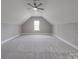 Spacious bonus room with grey carpet and a window at 725 Granna Ln, Lancaster, SC 29720