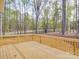 Large wooden deck offers a serene view of the surrounding wooded landscape at 725 Granna Ln, Lancaster, SC 29720