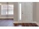 Charming entryway with a traditional front door and natural light pouring in from the adjacent window at 725 Granna Ln, Lancaster, SC 29720