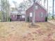 Charming brick home featuring manicured landscaping, symmetrical design, and welcoming front entry at 725 Granna Ln, Lancaster, SC 29720