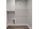 Well-lit laundry room with cabinets, storage, and utility connections at 725 Granna Ln, Lancaster, SC 29720