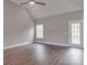 Bright living room with vaulted ceilings, wood floors, and a ceiling fan for added comfort at 725 Granna Ln, Lancaster, SC 29720