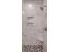 New shower with marble-like tiles, two shelves, and a shower seat at 725 Granna Ln, Lancaster, SC 29720
