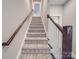 Stairway with grey carpet and wood banister at 725 Granna Ln, Lancaster, SC 29720