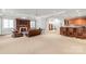 Entertainer's basement with a fireplace, TV, bar, and seating area at 7308 Amberwood Ct, Charlotte, NC 28226