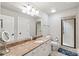 Bathroom featuring a double-sink vanity, glass shower, and neutral color scheme at 7308 Amberwood Ct, Charlotte, NC 28226