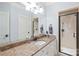 A bathroom with a glass shower, large mirror, and marbled countertops at 7308 Amberwood Ct, Charlotte, NC 28226