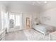 Bright bedroom with neutral tones, natural light, and decorative wall shelves at 7308 Amberwood Ct, Charlotte, NC 28226