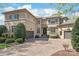 Stunning stucco home with a brick driveway and well-manicured landscaping at 7308 Amberwood Ct, Charlotte, NC 28226