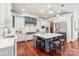 Gourmet kitchen with a large center island, custom cabinetry, and stainless steel appliances at 7308 Amberwood Ct, Charlotte, NC 28226