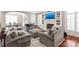 Bright and airy living room with a fireplace and an open layout to the dining area at 7308 Amberwood Ct, Charlotte, NC 28226