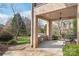 Elegant outdoor kitchen with a built-in grill, countertop, and a comfortable seating area at 7308 Amberwood Ct, Charlotte, NC 28226