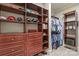 Custom wood shelving and drawers provide ample storage in this walk-in closet at 7308 Amberwood Ct, Charlotte, NC 28226