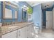 Inviting bathroom featuring double vanity, granite countertops, and a step-in shower at 7700 Red Oak Ln, Charlotte, NC 28226