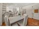Breakfast nook with hardwood floors, white cabinets, and stainless steel appliances at 7700 Red Oak Ln, Charlotte, NC 28226