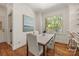 Bright breakfast nook with hardwood floors and view of outside foliage at 7700 Red Oak Ln, Charlotte, NC 28226