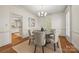 Charming dining room with wood floors, chandelier, and ample natural light at 7700 Red Oak Ln, Charlotte, NC 28226