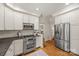 Well-appointed kitchen with stainless steel appliances, granite counters, and ample storage at 7700 Red Oak Ln, Charlotte, NC 28226
