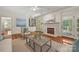 Bright living room with hardwood floors, built-in bookshelves, fireplace, and white trim at 7700 Red Oak Ln, Charlotte, NC 28226