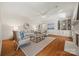 Spacious living room with hardwood floors, built-in bookshelves, and a neutral color palette at 7700 Red Oak Ln, Charlotte, NC 28226