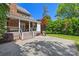 Inviting patio area offering stone flooring, brick accents, and a built-in grill at 7700 Red Oak Ln, Charlotte, NC 28226
