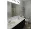 Bathroom featuring double sink vanity, stand-up shower, and built in shelving at 7814 Rolling Meadows Ln, Huntersville, NC 28078