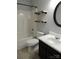 Bright bathroom featuring floating shelves, modern fixtures, and a sleek vanity at 7814 Rolling Meadows Ln, Huntersville, NC 28078
